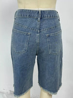 Blue denim shorts on a mannequin against a white background