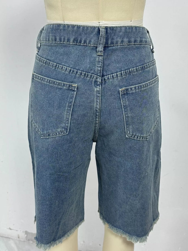 Blue denim shorts on a mannequin against a white background