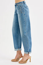 Light blue jeans worn by a person on a white background