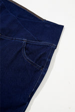 Close-up of a blue denim fabric with a white background
