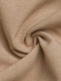 Close-up of beige fabric with a textured pattern