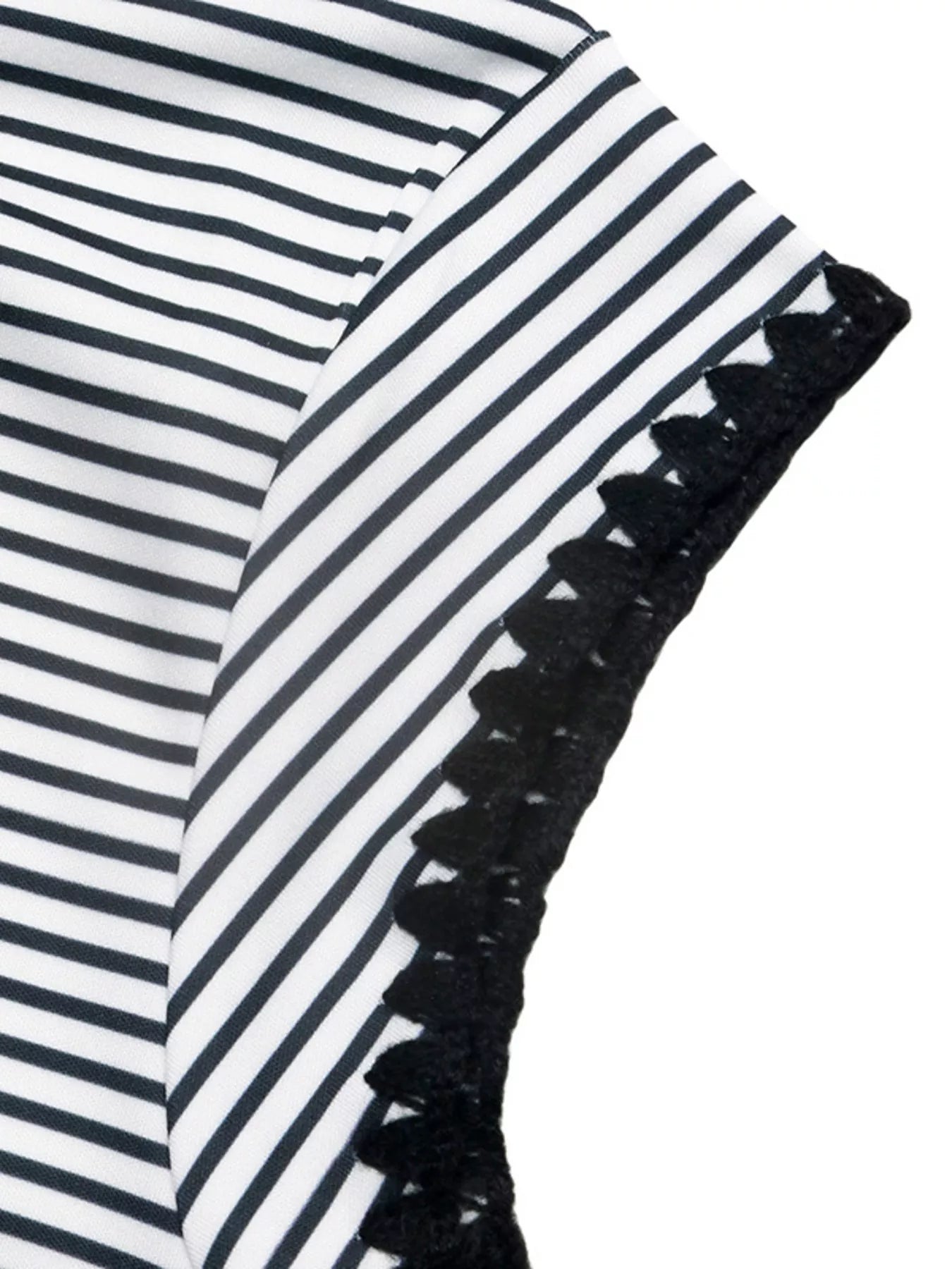 Black and white striped fabric with black lace trim on a white background