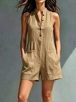 Woman wearing a beige sleeveless dress against a plain background