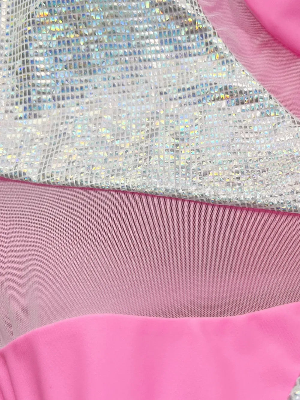 Close-up of a pink garment with silver sequin detailing