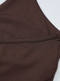 Brown fabric with a visible seam on a white background