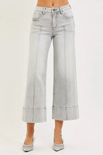 Light blue jeans with a white background