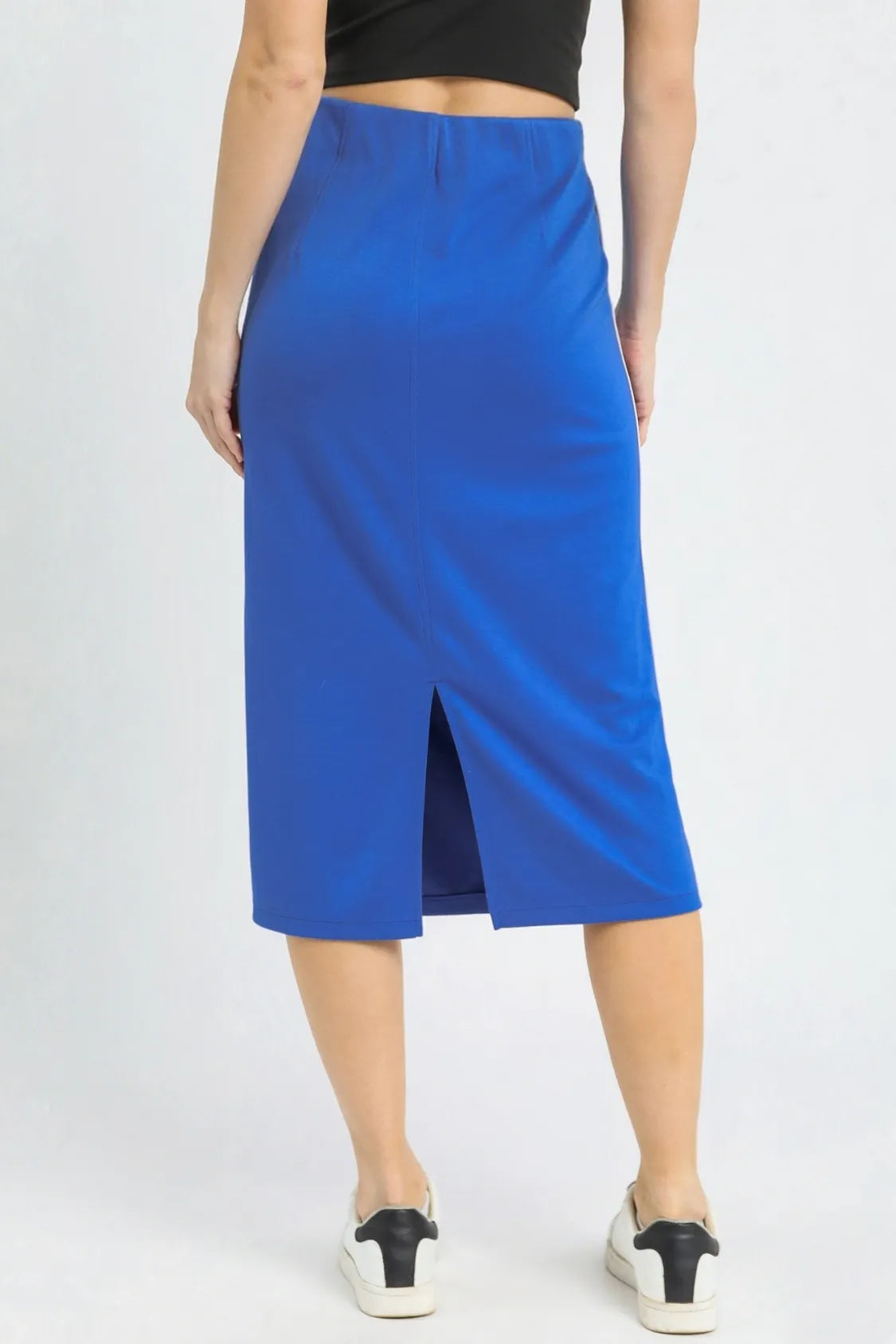 Person wearing a blue skirt on a white background