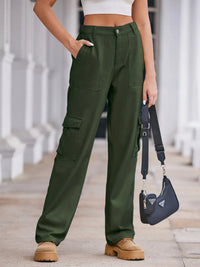 Person wearing green cargo pants with a blurred background