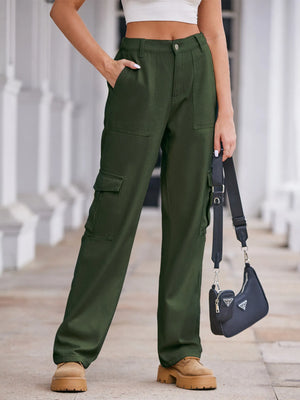 Person wearing green cargo pants with a blurred background