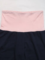 Navy blue skirt with a pink waistband on a white background