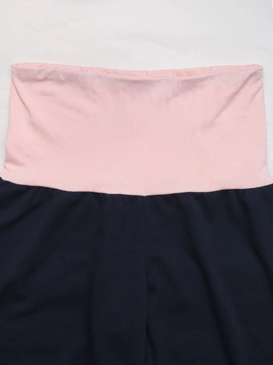 Navy blue skirt with a pink waistband on a white background