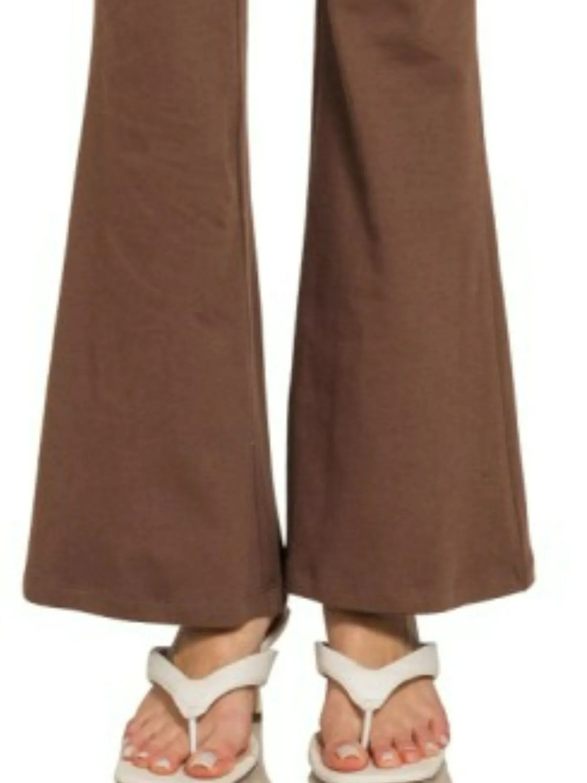 Brown wide-leg pants worn by a person on a white background