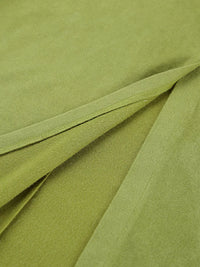 Close-up of green fabric with folds