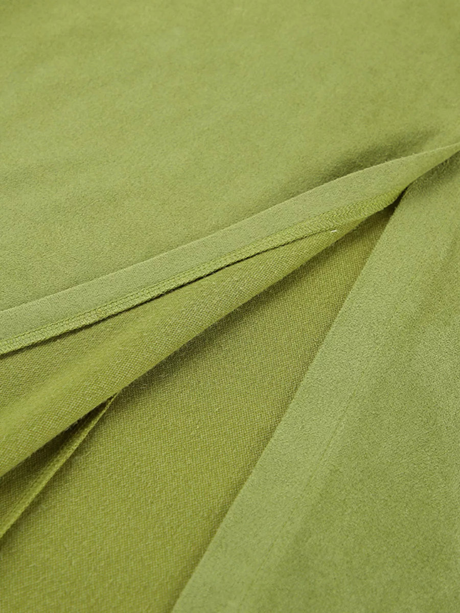 Close-up of green fabric with folds