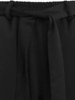 Close-up of black fabric with a belt