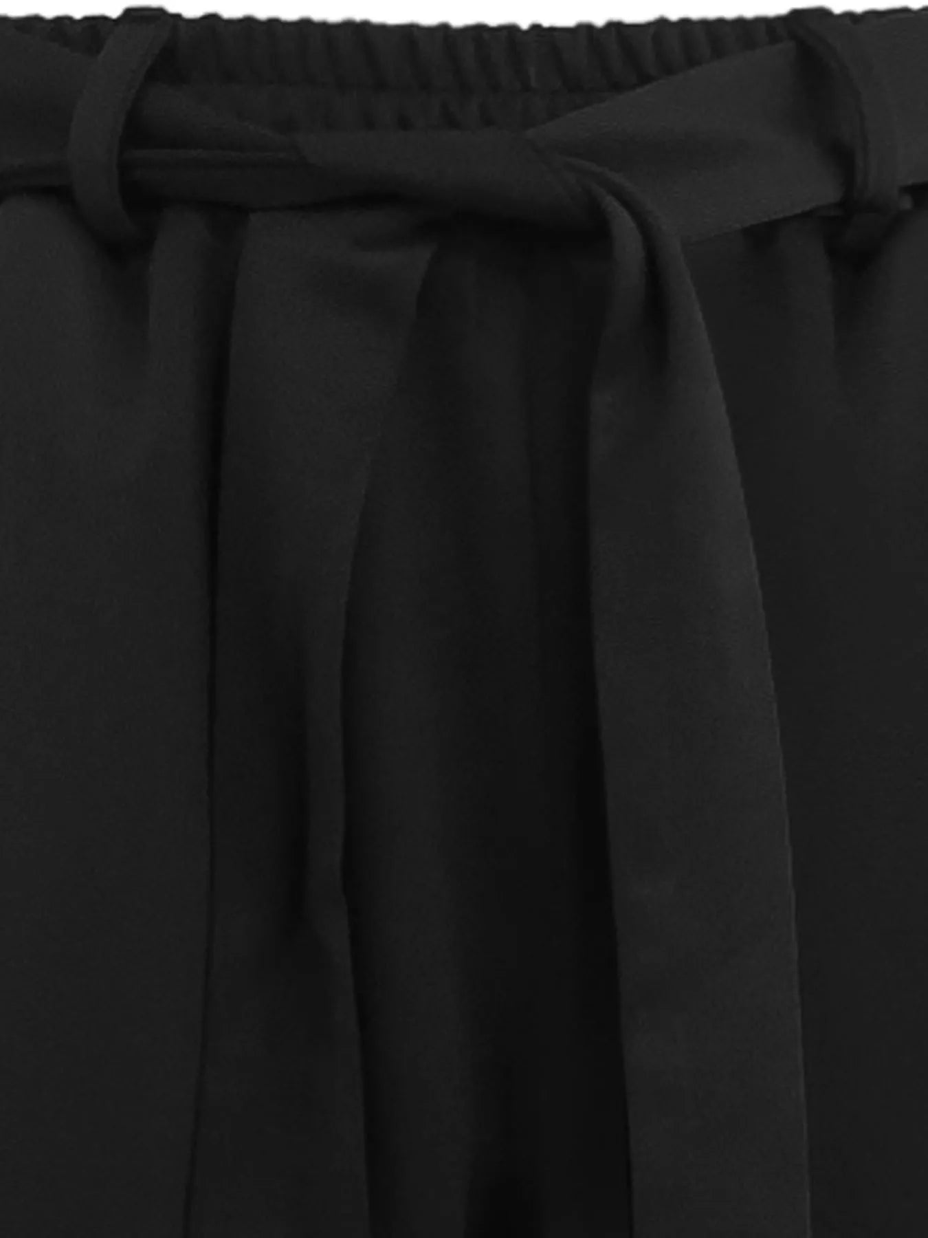 Close-up of black fabric with a belt