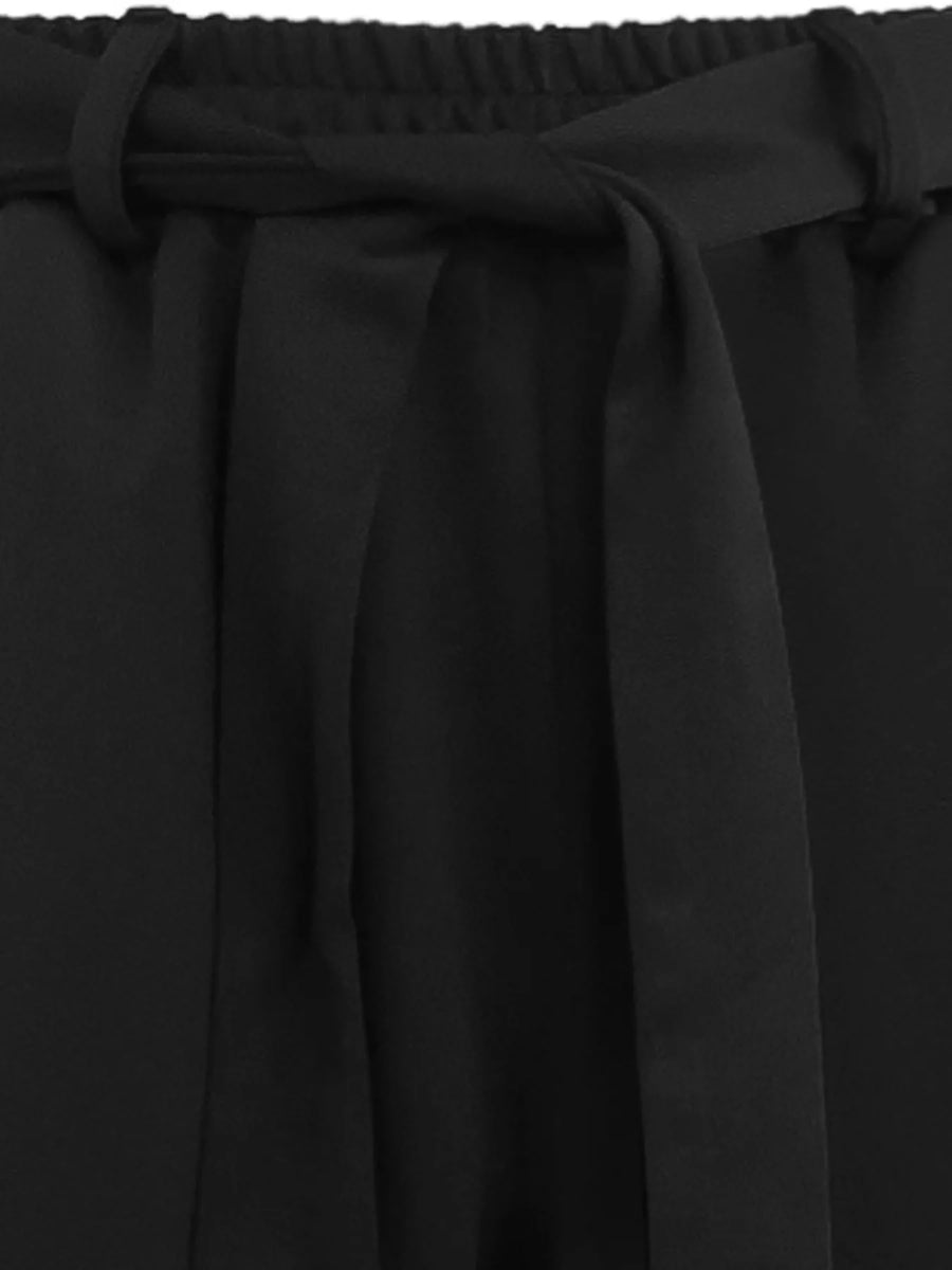 Close-up of black fabric with a belt