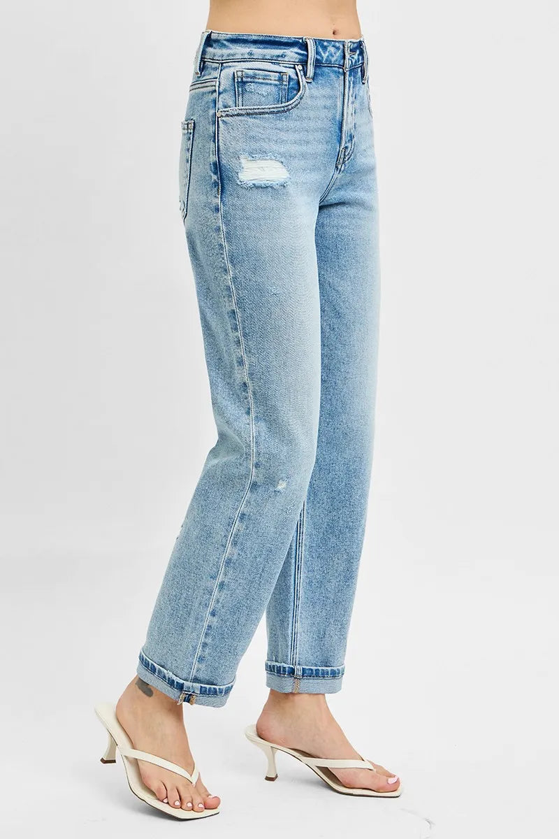 Light blue jeans with a distressed look on a white background