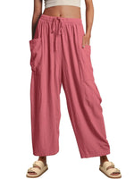 Woman showing pockets on baggy pants