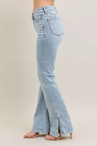 Light blue flared jeans on a neutral background