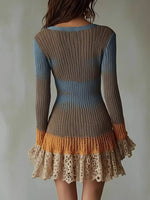 Knitted dress with gradient colors and lace details on a plain background