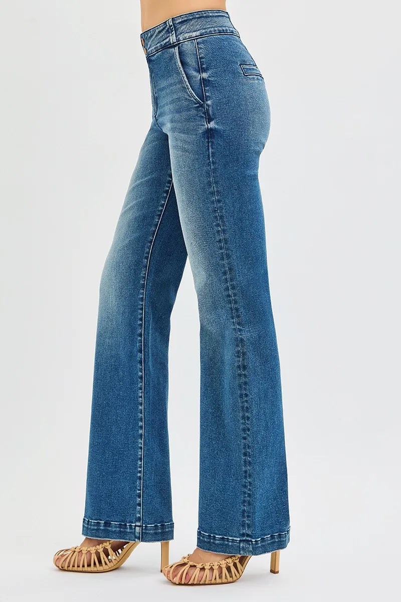 Blue jeans worn by a person on a white background
