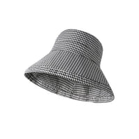 Black and white checkered sun visor hat on a white background