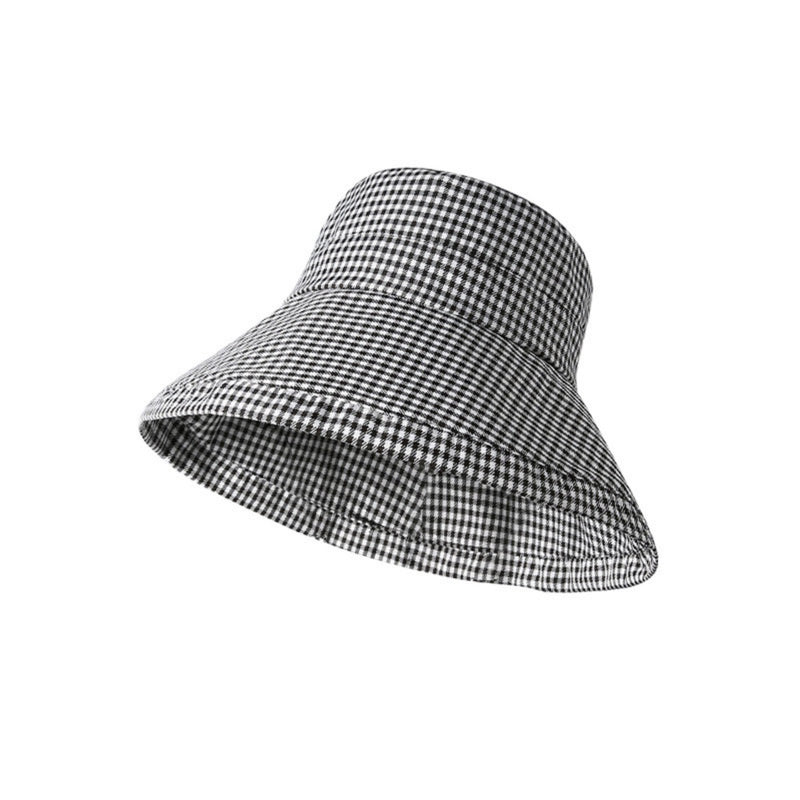 Black and white checkered sun visor hat on a white background
