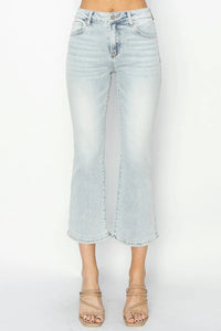 Light blue denim skirt worn by a person on a white background