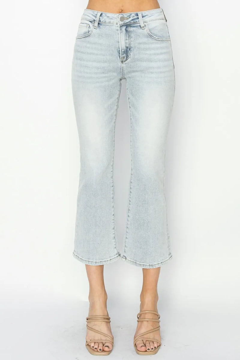 Light blue denim skirt worn by a person on a white background