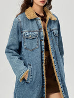 Blue denim jacket with beige sherpa lining on a white background