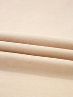 Close-up of beige fabric with a subtle texture