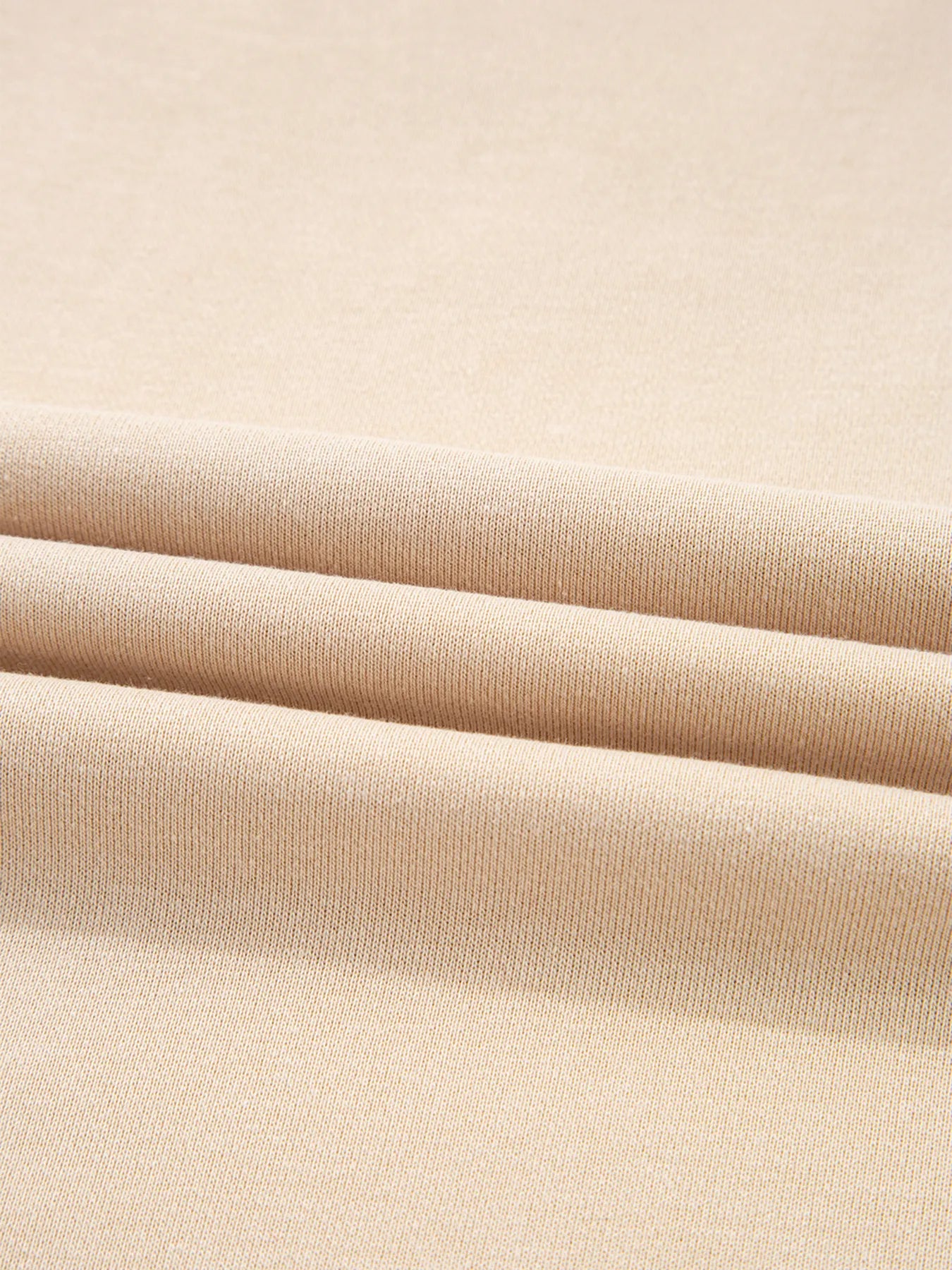 Close-up of beige fabric with a subtle texture