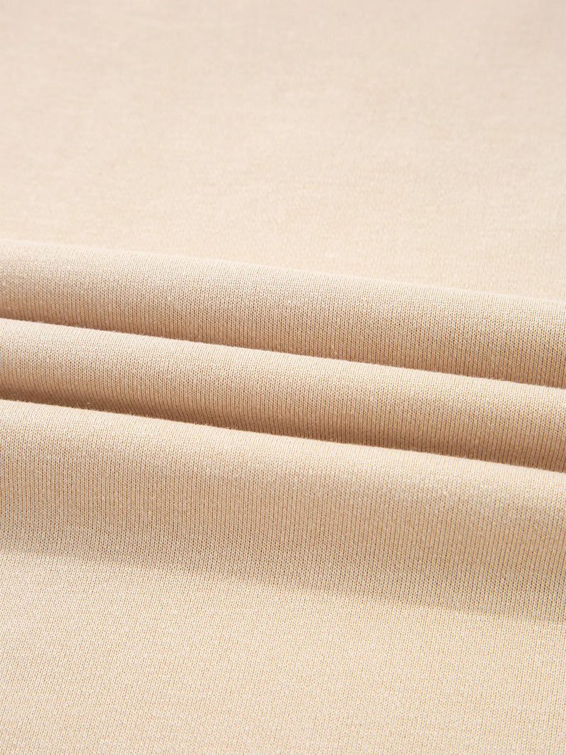 Close-up of beige fabric with a subtle texture