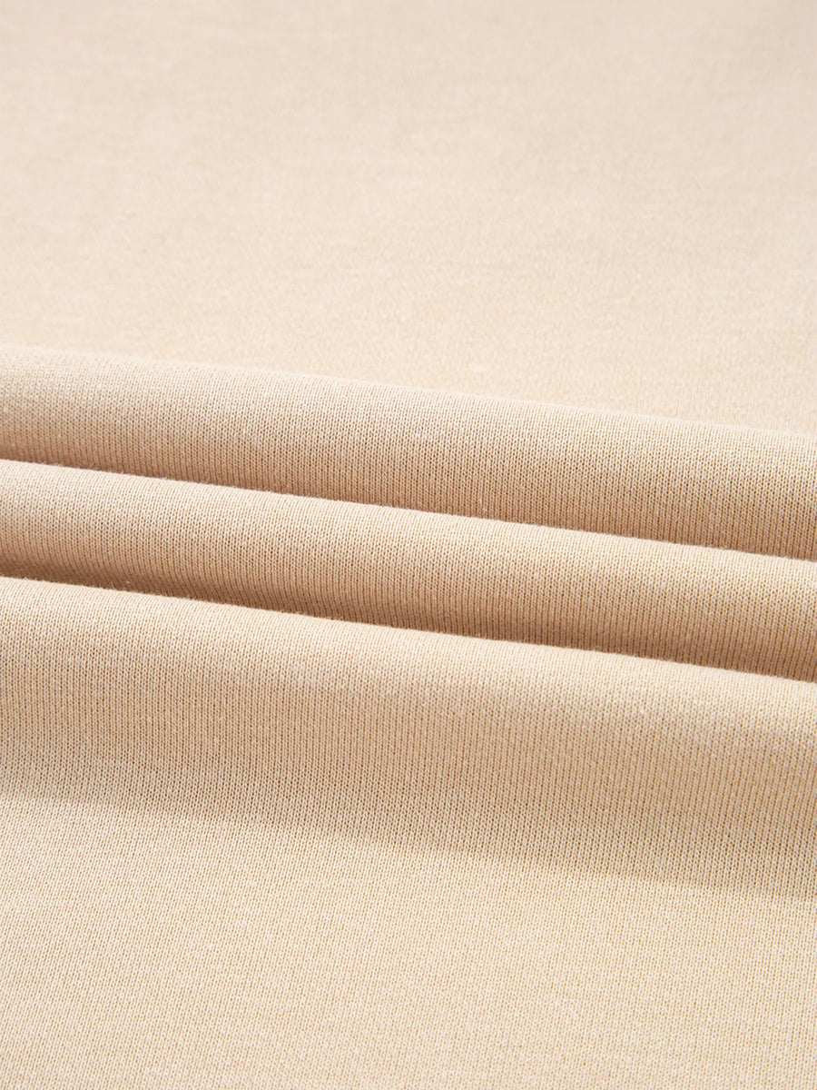 Close-up of beige fabric with a subtle texture