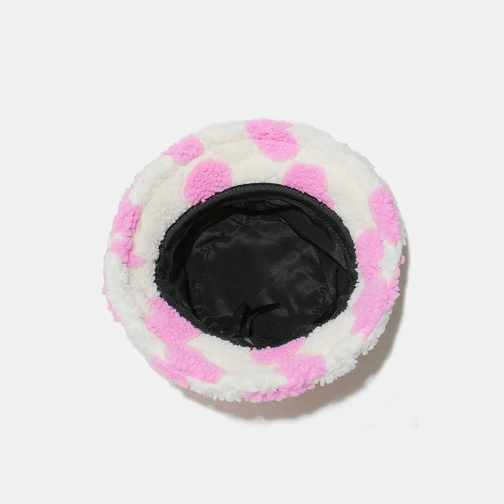 Round plush toy with pink and white checkered pattern on a white background