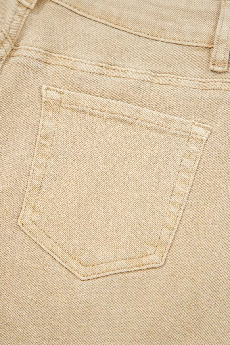 Close-up of a beige denim pocket
