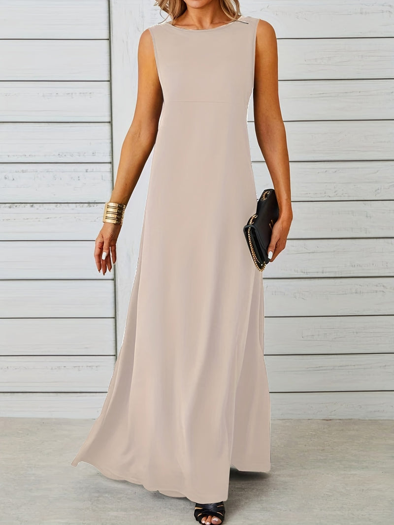 Woman wearing a long beige dress against a wooden background