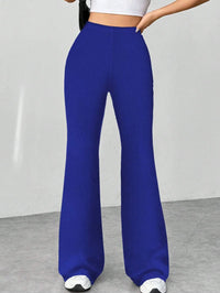 Blue wide-leg pants worn by a person on a plain background