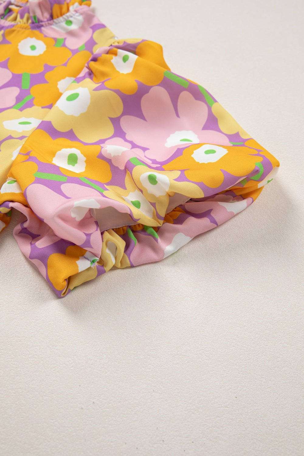 Colorful floral-patterned fabric on a light background