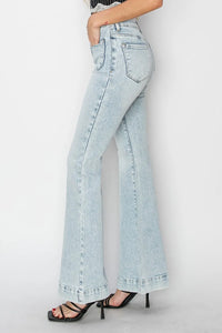 Light blue jeans worn by a person on a white background