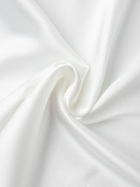 Close-up of white fabric with folds