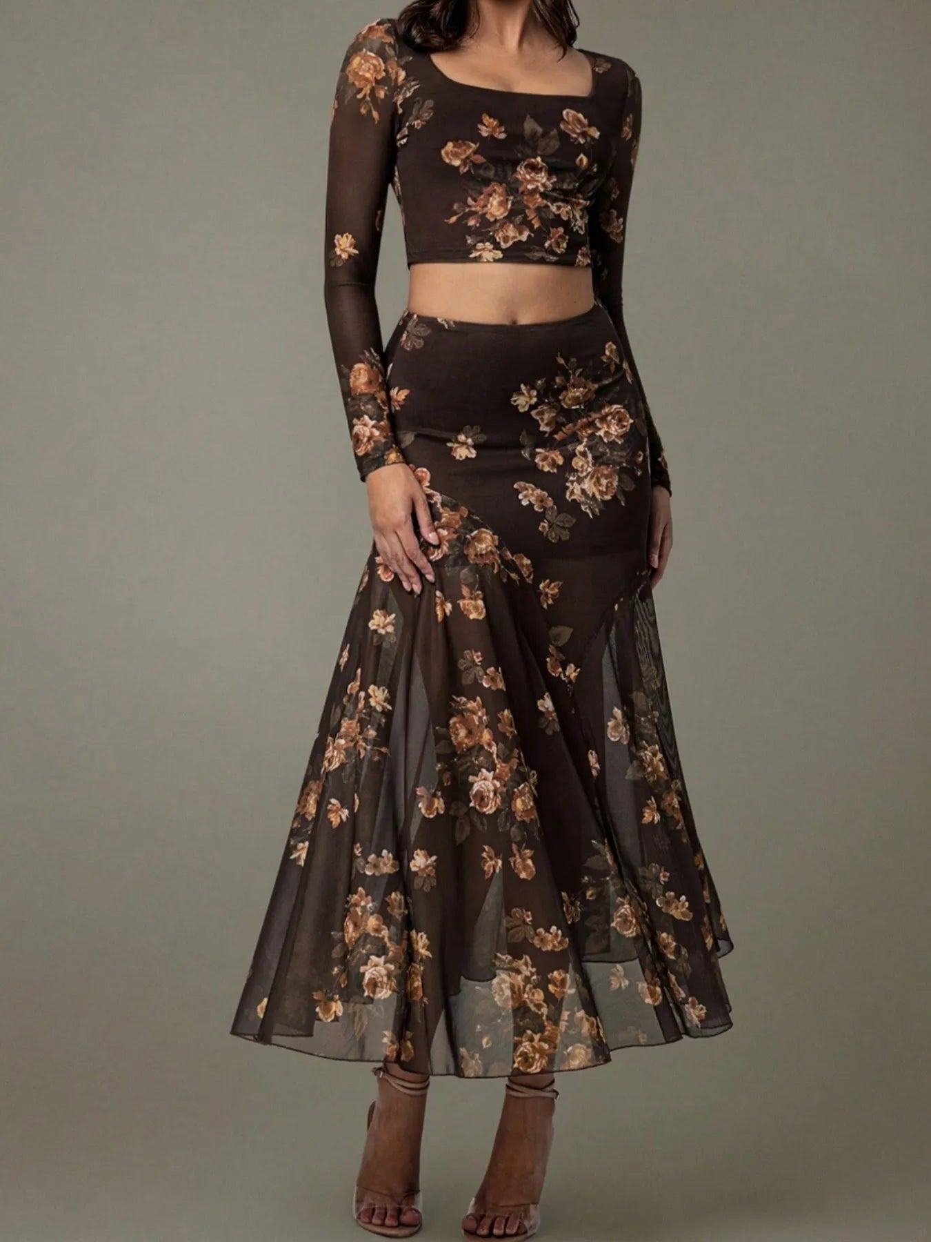 Dark floral two-piece outfit on a gray background
