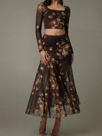 Dark floral two-piece outfit on a gray background