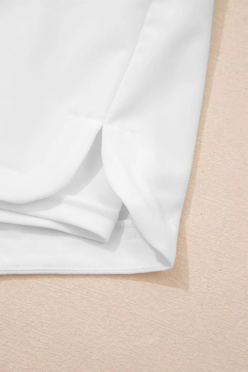 White fabric on a beige surface