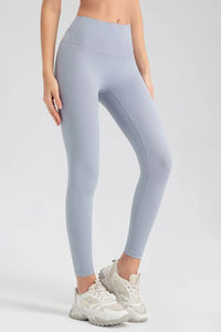 Light blue leggings worn by a person on a white background