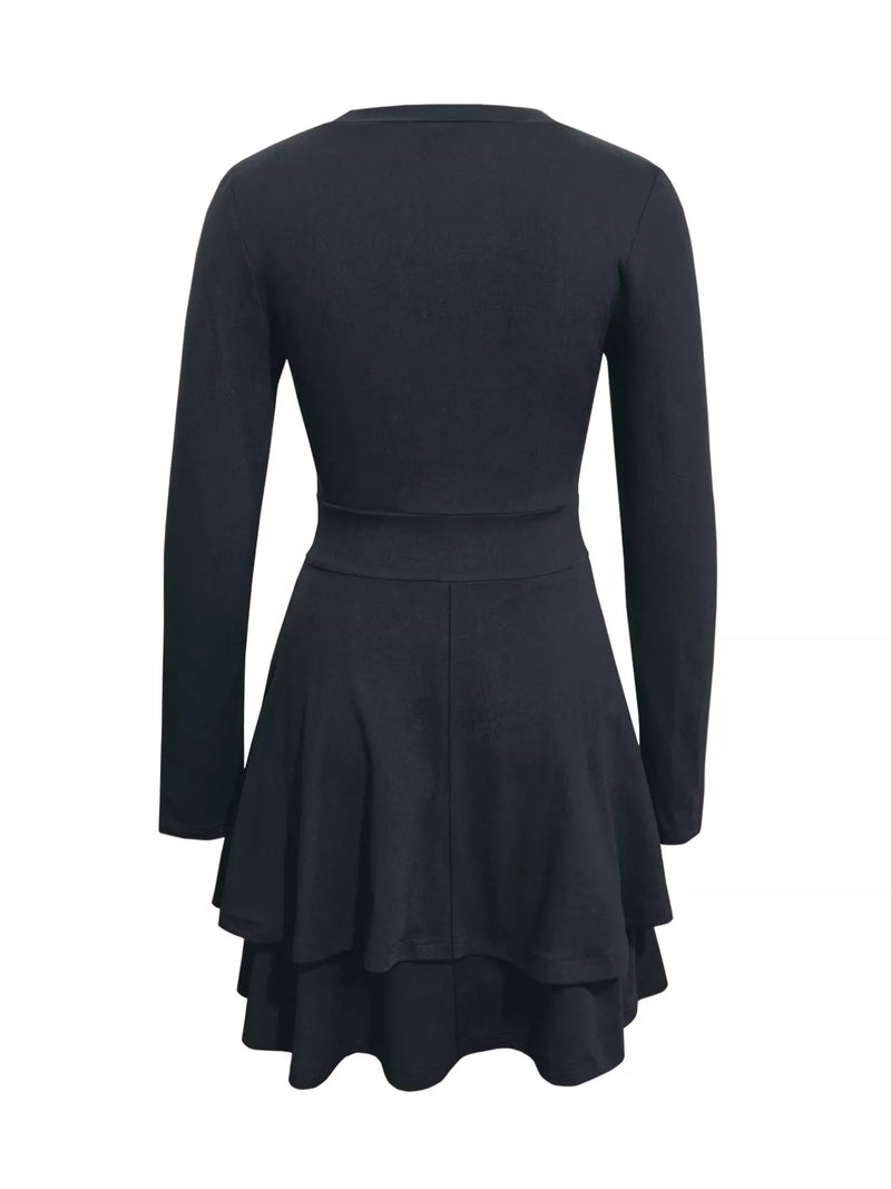 Black dress with long sleeves and a flared skirt on a white background