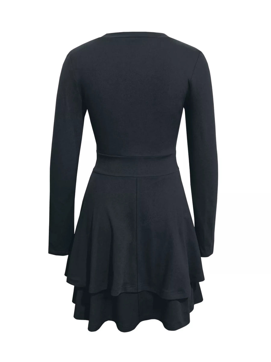 Black dress with long sleeves and a flared skirt on a white background