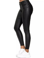 Black leather leggings worn by a person on a white background