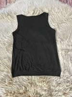 Black sleeveless top on a fluffy white surface